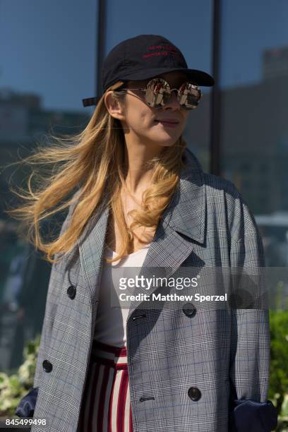 Canis Chow is seen attending Public School during New York Fashion Week wearing Public School on September 10, 2017 in New York City.