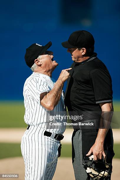 baseball coach and umpire arguing - angry coach stock pictures, royalty-free photos & images