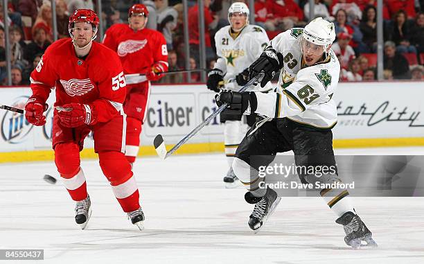 Niklas Kronwall of the Detroit Red Wings looks on as Stephane Robidas of the Dallas Stars shoots the puck during their NHL game at Joe Louis Arena...