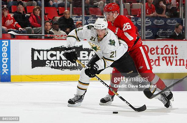 Jiri Hudler of the Detroit Red Wings defends against Loui Eriksson of the Dallas Stars during their NHL game at Joe Louis Arena January 29, 2009 in...