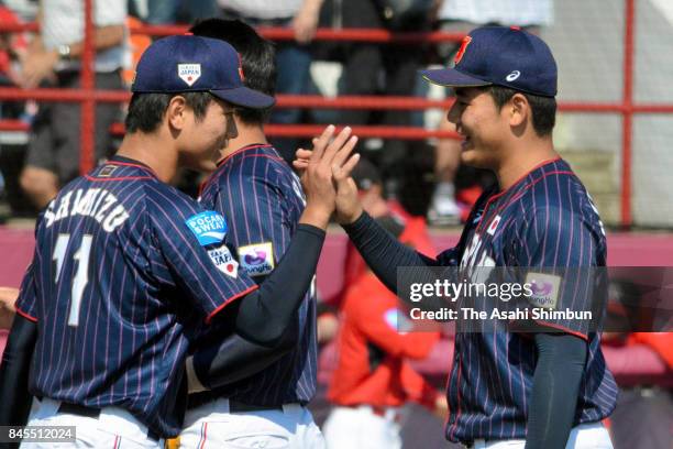 Kotaro Kiyomiya and Tatsuya Shimizu of Japan high five after the WBSC U-18 Baseball World Cup Bronze Medal Game between Japan and Canada at Port...