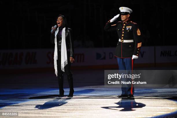 Tichina Arnold who plays Rochelle in the television series "Everybody Hates Chris" sings the national anthem before the game between the Los Angeles...