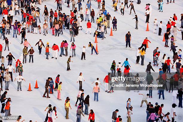 ice skaters - ice rink stock pictures, royalty-free photos & images