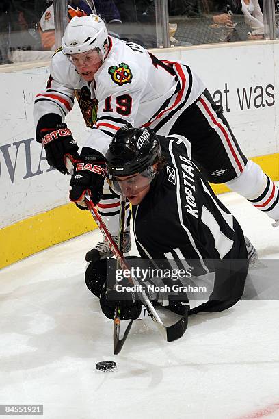 Jonathan Toews of the Chicago Blackhawks and Anze Kopitar of the Los Angeles Kings battle for the puck on January 29, 2009 at Staples Center in Los...