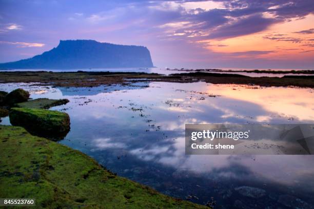 sunrise landscape at gwangchigi beachside - jeju stock-fotos und bilder