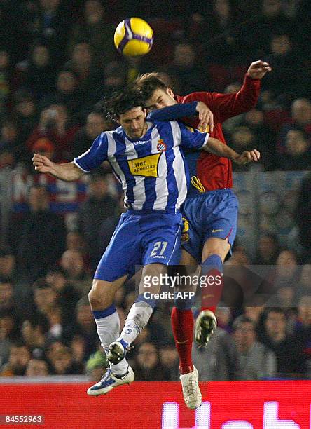 Barcelona's Gerard Pique fights for the ball with Espanyol's Dani Jarque , during the King's Cup football match at the New Camp Stadium on January...