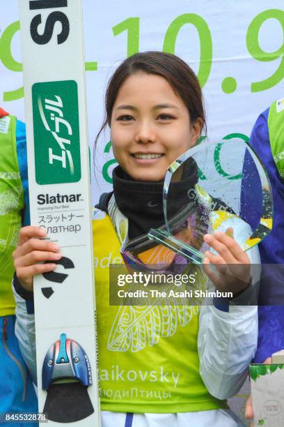 Winner Sara Takanashi of Japan cleebrates on the podium during day two of the FIS Ski Jumping Grand Prix on September 10, 2017 in Chaikovsky, Russia.