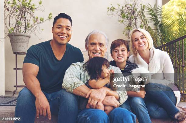 multigeneration family portrait - multi generational family with pet stock pictures, royalty-free photos & images