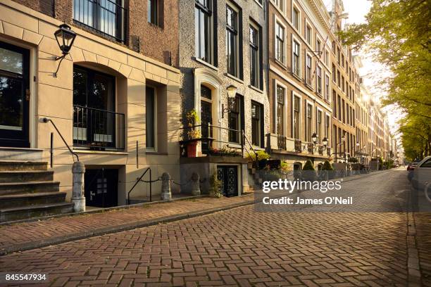 empty city residential road, amsterdam, netherlands - urban road stock pictures, royalty-free photos & images