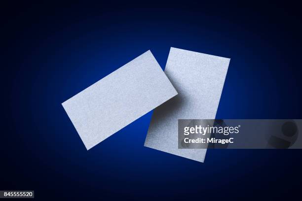 two sides of blue colored blank cards levitation - id cards bildbanksfoton och bilder