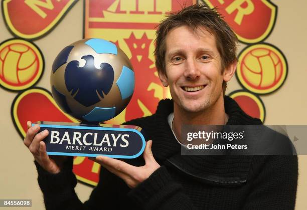 Goalkeeper Edwin van der Sar of Manchester United poses with an award from Barclays to mark his new Premier League record of eleven consecutive...