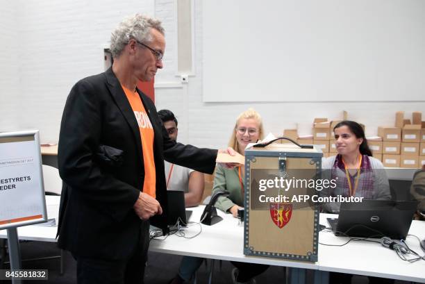 Rasmus Hansson, leader of Norway's Green Party , casts his ballot at a polling station in Bekkestua, Oslo, during general elections on September 11,...