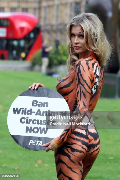 Joanna Krupa and PETA call for a ban on Animal Circuses outside The Houses of Parliament on September 11, 2017 in London, England.