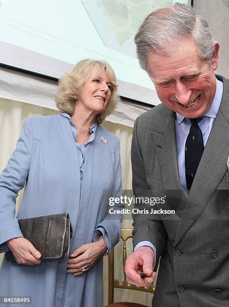 Prince Charles, Prince of Wales and Camilla, Duchess of Cornwall sign the visitors book as they tour Hereford Cathederal on January 30, 2009 in...