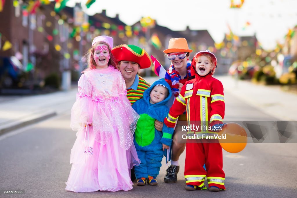 Kids and parents on Halloween trick or treat