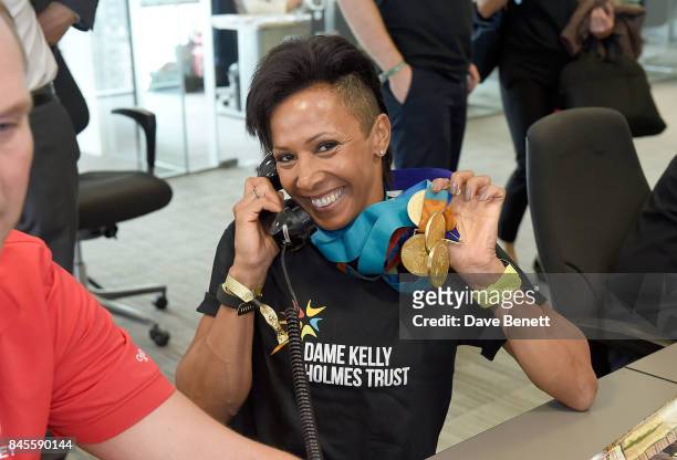 Dame Kelly Holmes representing The Dame Kelly Holmes Trust, makes a trade at BGC Charity Day on September 11, 2017 in Canary Wharf, London, United...