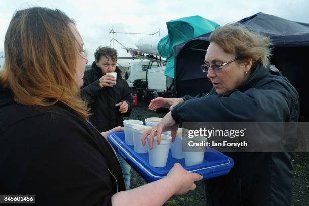 Hot drinks are brought to staff and volunteers as preparations are made ahead of the launch of the Skybolt 2 Research Rocket from Otterburn in...