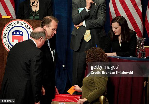 Committee staff watch as ballots are cast for Republican National Committee chairman during the RNC winter meeting January 30, 2009 in Washington,...