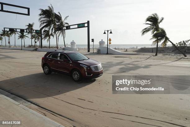 An abandoned car that was stranded in storm surge remains on North Fort Lauderdale Beach Boulevard one day after Hurricane Irma slamed into the...