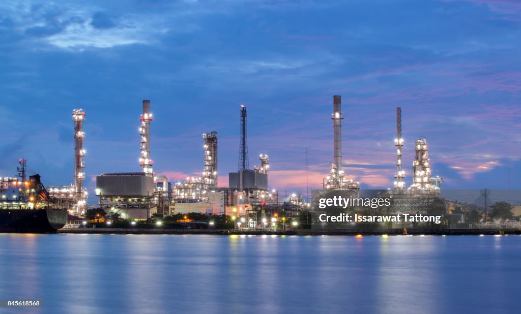 Oil refinery industry plant along twilight morning