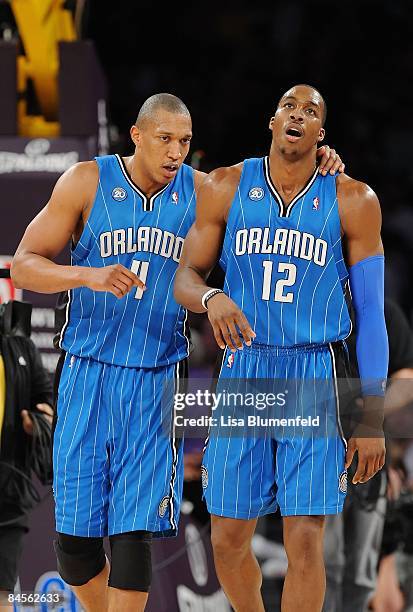 Tony Battie and teammate Dwight Howard of the Orlando Magic walk upcourt during the game against the Los Angeles Lakers at Staples Center on January...