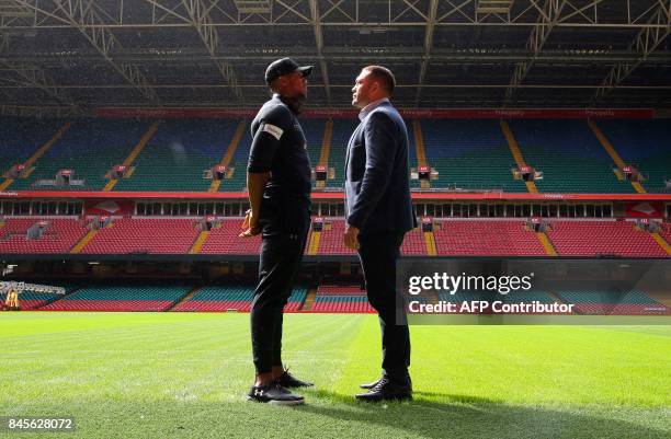 Britain's Anthony Joshua and Bulgaria's Kubrat Pulev stand on the pitch at the Principality Stadium in Cardiff on September 11, 2017 during a...