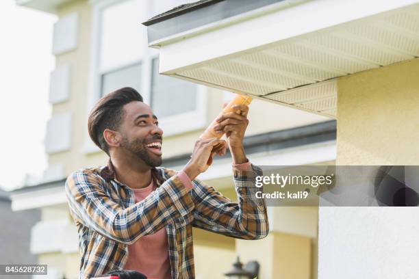 handyman doing home repairs - handyman smiling stock pictures, royalty-free photos & images