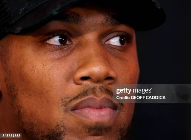 Britain's Anthony Joshua is seen during a press conference at the Principality Stadium in Cardiff on September 11, 2017 during an event to promote...