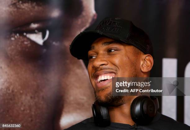 Britain's Anthony Joshua is seen during a press conference at the Principality Stadium in Cardiff on September 11, 2017 during an event to promote...