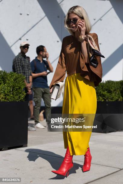 Adi Heyman is seen attending Public School during New York Fashion Week wearing a yellow skirt on September 10, 2017 in New York City.