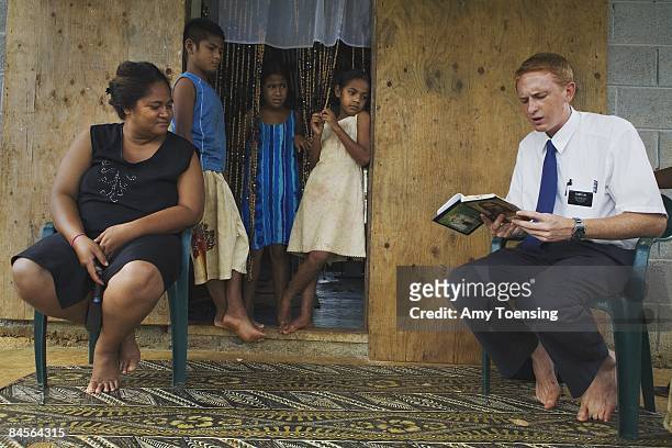 Elder Liki from Utah, visits and reads religious writings to villagers in Ha'alaufuli Village on April 19, 2007 in the Vava'u island group of Tonga....