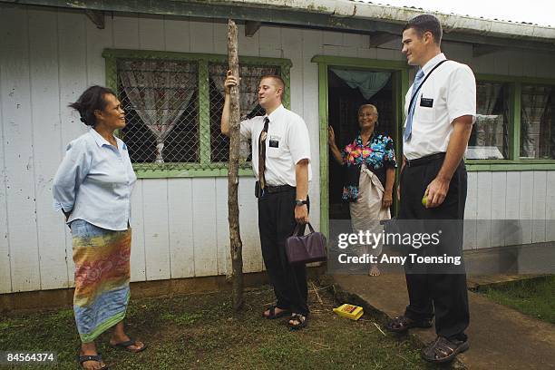 Mormon missionaries, Elder Swander and Elder Mathews make their way through Faleloa Village to say good-bye to villagers at the end of a six week...