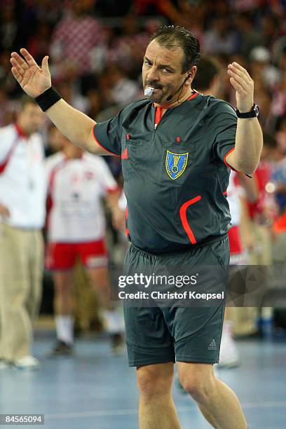 Referee Bernd Ullrich of Germany shows during the Men's World Handball Championships semi-final match between Croatia and Poland at the Zagreb Arena...