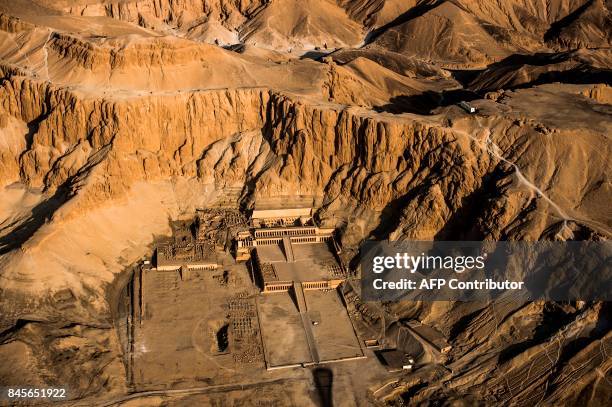 An aerial picture taken from a hot air balloon on September 10, 2017 shows the Temple of Hatshepsut, also known as the Djeser-Djeseru in the southern...