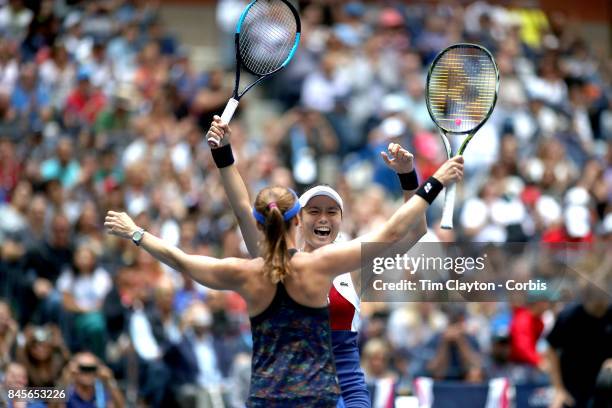 Open Tennis Tournament - DAY FOURTEEN. Martina Hingis of Switzerland and Yung-Jan Chan of Chinese Taipei celebrate winning the Women's Doubles Final...