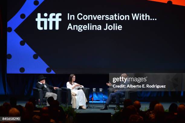 Producer/filmmaker Rithy Panh, Director Angelina Jolie and Director of the Toronto International Film Festival Cameron Bailey speak onstage at the In...