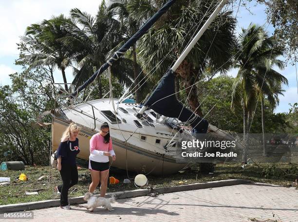 Boat is seen washed ashore at the Dinner Key marina after hurricane Irma passed through the area on September 11, 2017 in Miami, Florida. Florida...