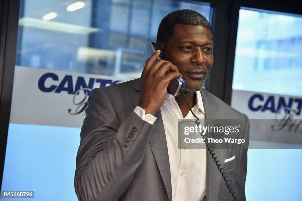 Basketball player Larry Johnson participates in Annual Charity Day hosted by Cantor Fitzgerald, BGC and GFI at Cantor Fitzgerald on September 11,...