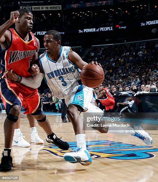 Chris Paul of the New Orleans Hornets drives against Kelenna Azubuike of the Golden State Warriors on January 30, 2009 at the New Orleans Arena in...