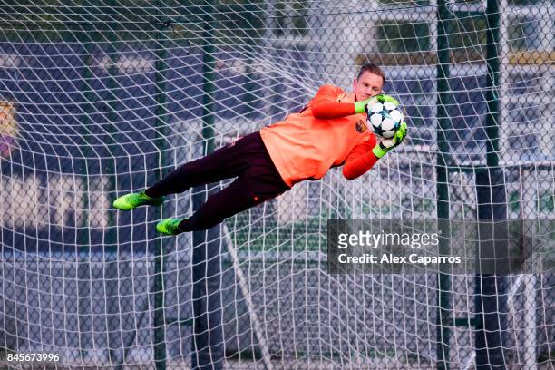 Marc-Andre Ter Stegen of FC Barcelona blocks the ball during a training session ahead of the UEFA Champions League Group D match against Juventus on...