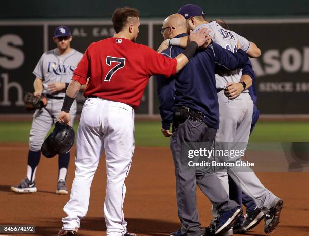 Boston Red Sox catcher Christian Vazquez wishes Tampa Bay Rays right fielder Steven Souza Jr. Well as he is helped off the field after injuring...