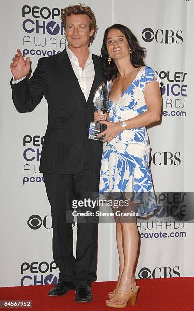 Actors Simon Baker and Robin Tunney poses in the press room at the 35th Annual People's Choice Awards held at the Shrine Auditorium on January 7,...