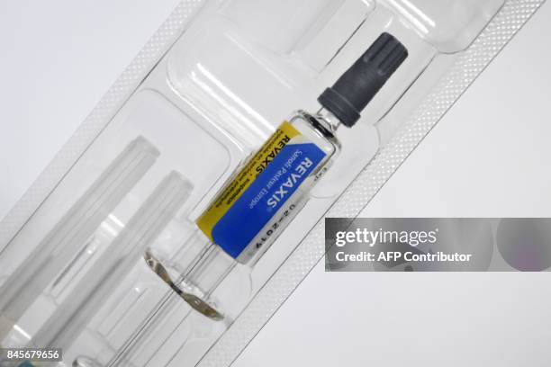 Picture taken on September 11, 2017 in Quimper, western France, shows a pre-filled syringe for a Revarix combined vaccine protecting against...