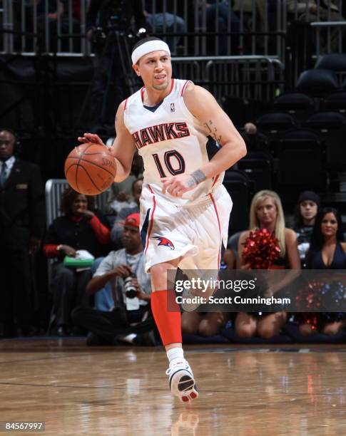 Mike Bibby of the Atlanta Hawks drives against the New Jersey Nets at Philips Arena on January 30, 2009 in Atlanta, Georgia. NOTE TO USER: User...