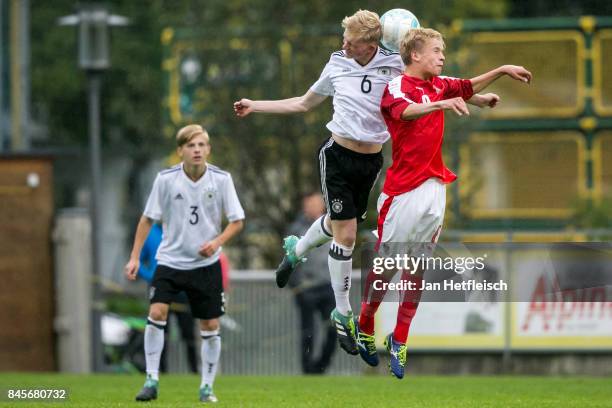 Jomaine Ellay Consbruch of Germany and Matthias Braunoeder of Austria fight for the ball during the friendly match between U16 Austria and U16...