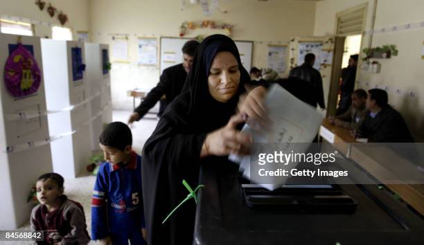 An Iraqi woman casts her vote on January 31, 2009 in Sadr city district in Baghdad, Iraq. Iraqis went to the polls on January 31, 2009 to elect their...