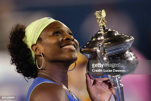 Serena Williams of the United States of America poses with the Daphne Akhurst Trophy after winning the women's final match against Dinara Safina of...