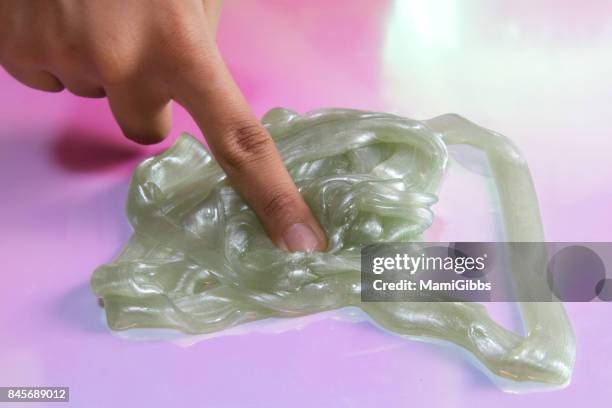 silver green slime toy - sticky stock pictures, royalty-free photos & images