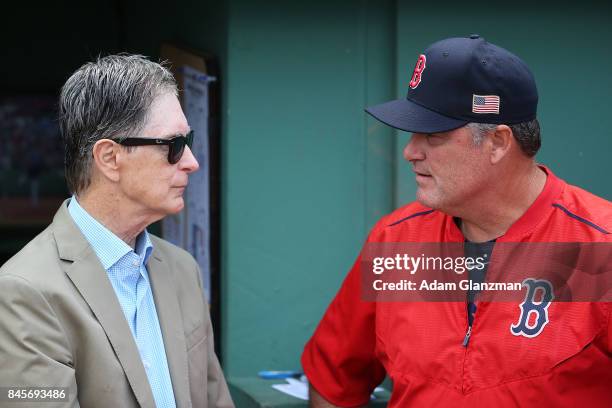 Boston Red Sox manager John Farrell and Boston Red Sox owner John Henry talk before a game between the Boston Red Sox and the Tampa Bay Rays at...