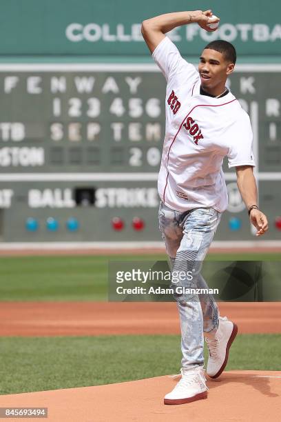 Boston Celtics first round draft pick Jayson Tatum throws out the ceremonial first pitch before a game between the Boston Red Sox and the Tampa Bay...